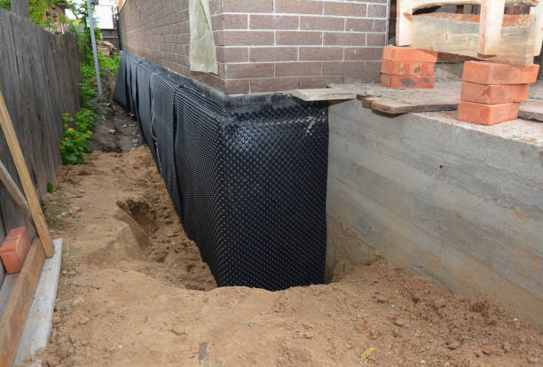 SJ Waterproofing Pros technician performing targeted Sump Pump Installation assessment in Southgate, KY